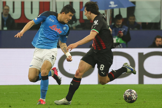 Napoli defender Kim Min-jae in action against AC Milan's Sandro Tonali during a UEFA Champions League quarterfinal match at San Siro in Milan, Italy on Wednesday. [EPA/YONHAP]