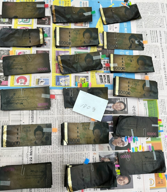 The scorched 50,000-won ($38.5) bills that were replaced with new banknotes [BANK OF KOREA]