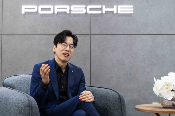 Chung Woo-sung, a senior exterior designer at Porsche, speaks during a recent interview with the Korea JoongAng Daily at Kintex, Gyeonggi. [PORSCHE KOREA] 