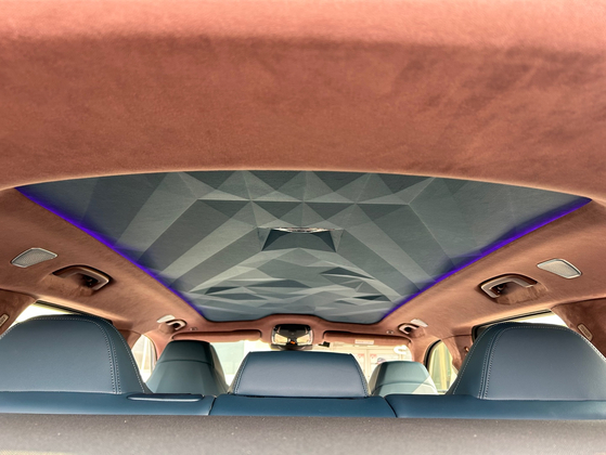 BMW used more than 100 LEDs in the headliner, which offers ambient lighting and provides additional alerts for incoming calls and safety notifications. [SARAH CHEA] 
