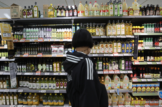 A customer shops at a discount mart in Seoul on April 20. [YONHAP]