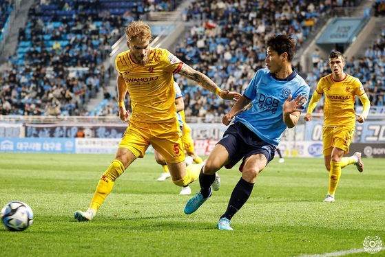 Gwangju FC's Timo Letschert, left, in action during a K League game against Daegu FC at DGB Daegu Bank Park in Daegu in a photo shared on Gwangju's official Facebook account on Sunday. [SCREEN CAPTURE] 