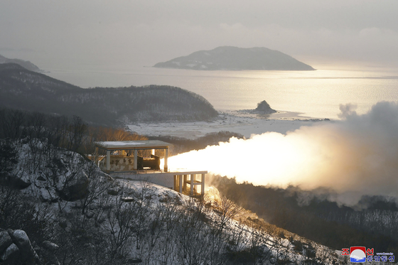 North Korea tests a ″high-thrust solid-fuel″ rocket at the Sohae Satellite Launching Station in Tongchang-ri, North Pyongan Province on Dec. 15, 2022, in a photo released by its official Korean Central News Agency. [YONHAP]
