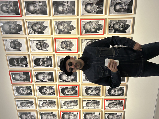 French photographer and street artist JR during a press preview at the Lotte Museum of Art earlier this month for his first Korean solo exhibition, "Chronicles." [SHIN MIN-HEE]
