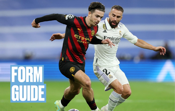 Manchester City's Jack Grealish, left, in action against Real Madrid's Dani Carvajal during the first leg of the Champions League semifinals at Santiago Bernabeu in Madrid, Spain on May 9. [ONE FOOTBALL]
