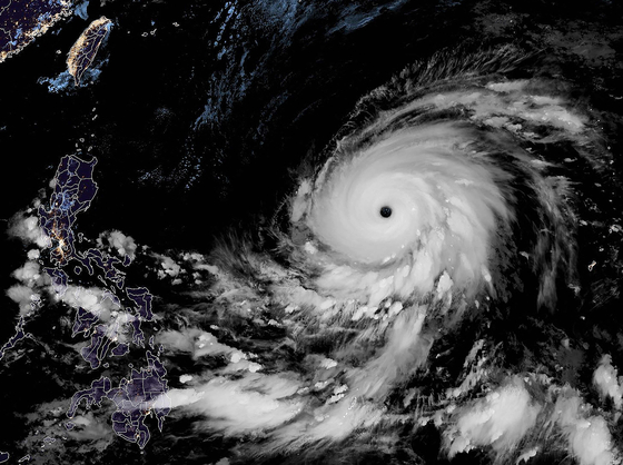 This satellite image obtained from the The National Oceanic and Atmospheric Administration shows Typhoon Mawar as it moves away from Guam on Friday at 14:30 UTC. [AFP/YONHAP]
