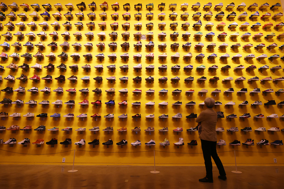 Sneakers are displayed at the Sneakers Unboxed Seoul: Studio to Street exhibition at Sejong Museum of Art in central Seoul on Tuesday. It is a touring exhibition from the Design Museum, London. The exhibition runs through Sept. 10. [YONHAP] 
