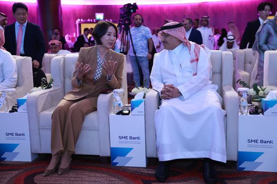 Lee Young, left, Minister of SMEs and Startups, and Yousef Al Benyan, chairman of the board of directors at Saudi Arabia's SME Bank, during a fund establishment ceremony held at the Crowne Plaza hotel in Riyadh on Sunday [MINISTRY OF SMES AND STARTUPS]