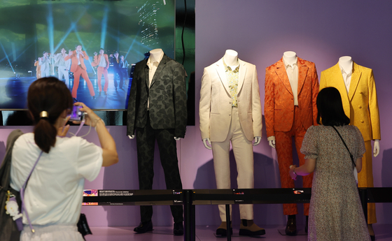 Outfits worn by BTS members during their performance of "Dynamite" at the 2021 Grammy Awards are displayed at Kensington Hotel in Yeouido, western Seoul, Tuesday, in celebration of the boy band's 10th anniversary of debut. The 2021 performance marked the first time a Korean artist performed on the Grammy stage. [YONHAP] 