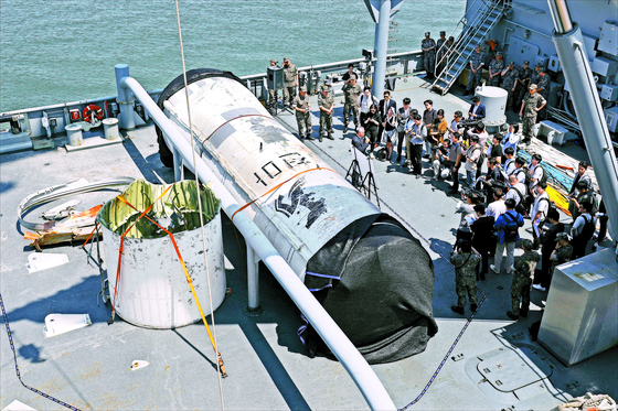 A retrieved part of the North Korean satellite launch vehicle (SLV) which sank in the Yellow Sea after the North's failed launch on May 31, is revealed to the press on Friday. [KOREA PRESS PHOTOGRAPHER'S ASSOCIATION] 