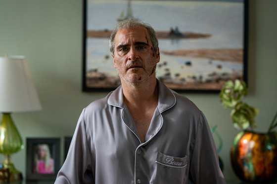 Joaquin Phoenix plays the titular Beau in ″Beau Is Afraid,″ who suffers from anxiety and has to travel to attend his mother's funeral in Ari Aster's new film [SIDUS MOVIE]