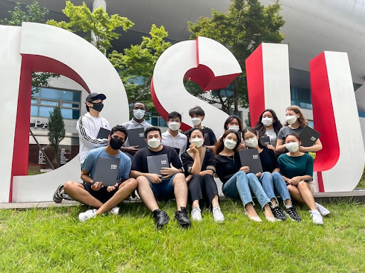 Celebrating graduation day at Busan Dongseo University Language School in 2021 with classmates; outside a stadium in Seoul in 2022 for a Blackpink concert [ABDUL SAMEED ABDULWAHAB]