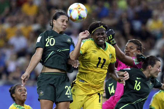 Jamaica's Khadija Shaw, center, jumps for the ball during a Women's World Cup Group C match at Stade des Alpes in Grenoble, France on June 18, 2019.  [AP/YONHAP]