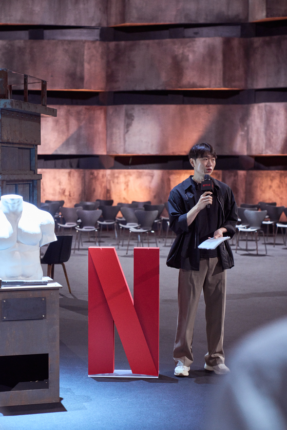 Main producer of ″Physical:100″ Jang Ho-gi speaks during a press event to introduce the set of the second season of the popular Netflix reality television show at Kintex in Goyang, Gyeonggi, on Wednesday. [NETFLIX] 