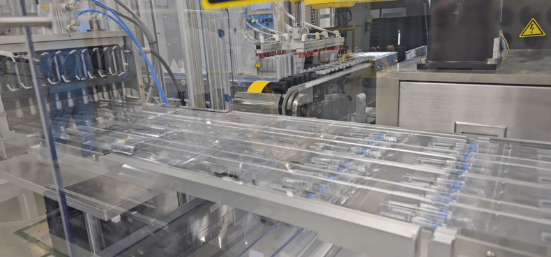 Pre-filled syringes of SKYCellflu influenza vaccine on the packaging line at SK bioscience’s Andong L House manufacturing plant in North Gyeongsang on Tuesday [SHIN HA-NEE]