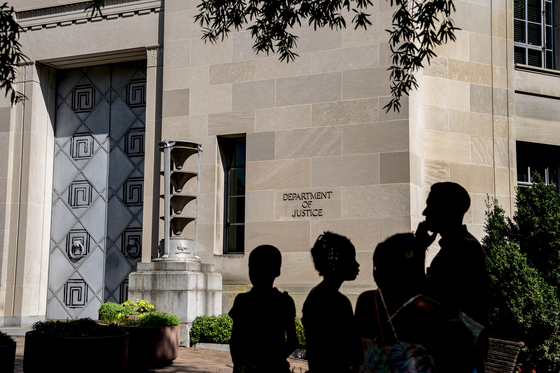 The Department of Justice in Washington, July 16, 2023. The federal government has charged 3,195 defendants for offenses related to pandemic fraud and seized more than $1.4 billion in relief funds, according to data released by the department. [Haiyun Jiang/The New York Times]