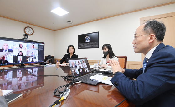Finance Minister Choo Kyung-ho talks to officials of the International Monetary Fund in a video teleconference on Tuesday. [MINISTRY OF ECONOMY AND FINANCE]