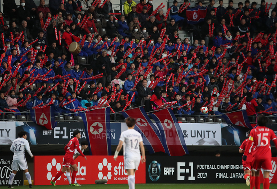 North Korean football fans cheer for their women's team during a 2017 EAEF E-1 Football Championship match against South Korea at Fukuda Denshi Arena in Chiba, Japan on Dec. 11, 2017. [YONHAP] 