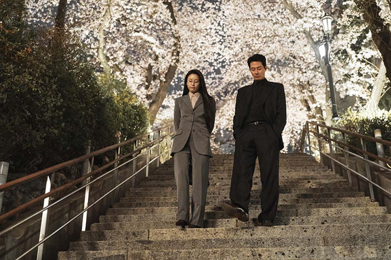 Han Hyo-joo's Mi-hyun, left, and Zo In-sung's Doo-sik, walk around Namsan during a scene of "Moving." [DISNEY+]