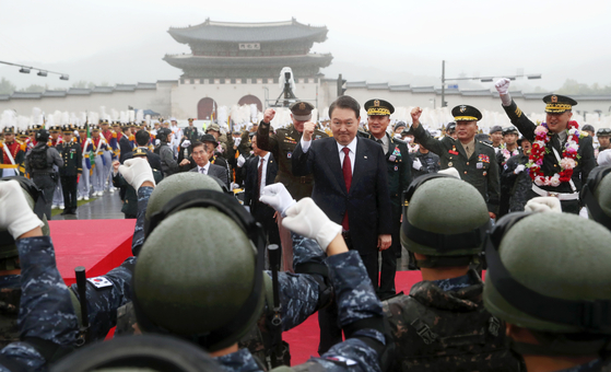 President Yoon Suk Yeol, center, gives words of encourage to troops during a massive military parade in Gwanghwamun Square in central Seoul on Tuesday afternoon to commemorate the 75th Armed Forces Day, which falls on Sunday. This is the first military parade in the streets of Seoul in a decade, with thousands of troops and nearly 200 military equipment showcased, including high-powered missiles. [JOINT PRESS CORPS]