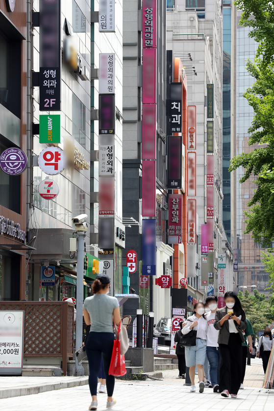 Signs for hospitals performing plastic surgery are seen on a street in Gangnam District, southern Seoul, on May 14, 2020. Gangnam is known as the mecca for plastic surgery hospitals in Seoul. [NEWS1]