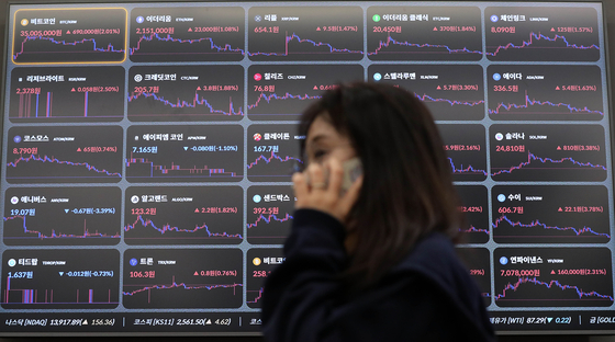 A display in the Bithumb building in Gangnam District, southern Seoul, shows cryptocurrency prices on Sept. 12. [NEWS1] 