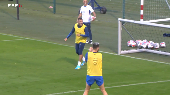 Kylian Mbappe, center, celebrates after scoring a diving header during the French national team's training. [ONE FOOTBALL] 