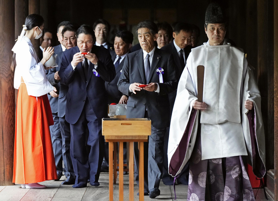 In this file photo dated Aug. 15, Japanese lawmakers, including Ichiro Izawa, right, visit the Yasukuni Shrine. 15. [YONHAP] 