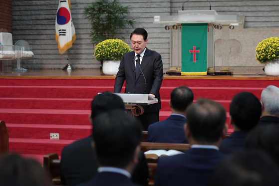President Yoon Suk Yeol at the Youngahm church in Seongbuk District on Sunday to attend a memorial service for the 159 people that died from a stampede at Itaewon a year ago on Halloween weekend. [YONHAP]