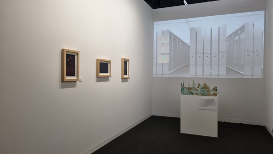 Works by artist Yu Choong-hwan created to express the cycle of creation and destruction is held as part of a promotional booth for Arshexa, a host partner of the Paris+ par Art Basel, on Oct. 18. [YOON SO-YEON]