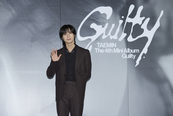 Taemin of boy band SHINee poses for photos during a press conference held on Monday at the Megabox Seongsu branch in eastern Seoul ahead of the release of his fourth EP ″Guilty″ at 6 p.m. [SM ENTERTAINMENT]
