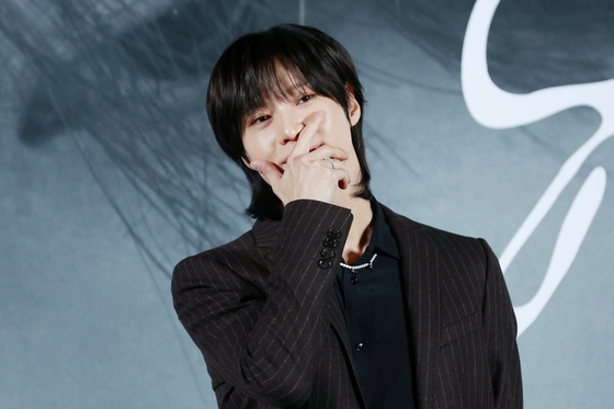 Taemin of boy band SHINee poses for photos during a press conference held Monday at the Megabox Seongsu branch in eastern Seoul ahead of the release of his fourth EP ″Guilty″ at 6 p.m. [YONHAP]