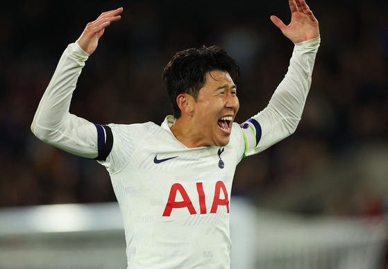 Tottenham Hotspur's Son Heung-min celebrates after scoring their second goal against Crystal Palace at Selhurst Park in London on Friday.  [REUTERS/YONHAP]