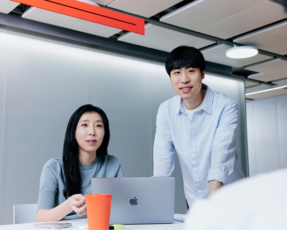 Lim Jung-hwa, leader of Hyperscale AI Planning, left, and Lee Sang-woo, leader of Hyperscale AI at Naver Cloud pose for the photo. [NAVER]