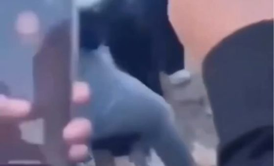 Students video the assault of two girls in Cheonan, South Chungcheong on Oct. 21. [YONHAP]