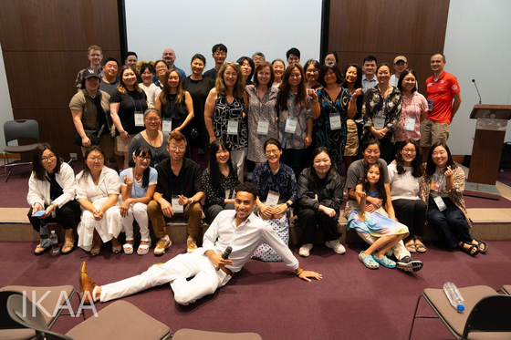 Robert Holloway, center front, with adoptees and their families during the International Korean Adoptee Associations gathering in Seoul in July. [IKAA]