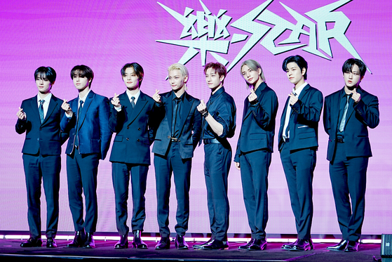 Members of boy band Stray Kids pose for photos during a press conference held on Friday at the Conrad Seoul hotel in western Seoul in celebration of the release of its new EP ″Rock-Star.″ [KIM MYEONG-JI]
