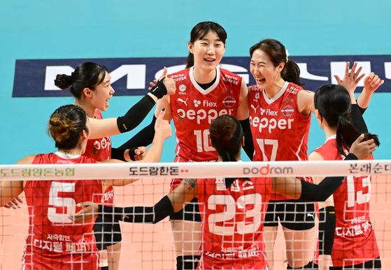 The Gwangju AI Peppers cheer after scoring against the GS Caltex Seoul Kixx in a match at Jangchung Gymnasium in Seoul on Friday. [KOVO]