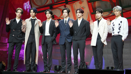 Members of boy band Enhypen pose for photos during a showcase held on Thursday at the Yes24 Live Hall in eastern Seoul for its fifth EP ″Orange Blood.″ [KIM MYEONG-JI]