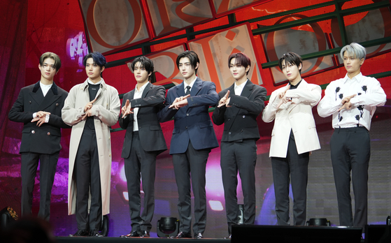 Members of boy band Enhypen pose for photos during a showcase held on Thursday at the Yes24 Live Hall in eastern Seoul for its fifth EP ″Orange Blood.″ [KIM MYEONG-JI]