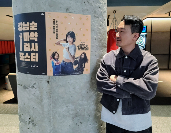 Art director Kim Kang-min with the ″Strong Girl Nam-soon″ promotional posters [CHEIL WORLDWIDE]