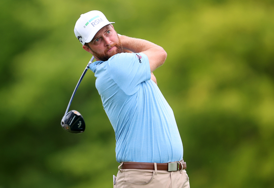 Chris Kirk of the United States plays his shot from the ninth tee during the second round of the John Deere Classic at TPC Deere Run in Silvis, Illinois on July 7.  [GETTY IMAGES]