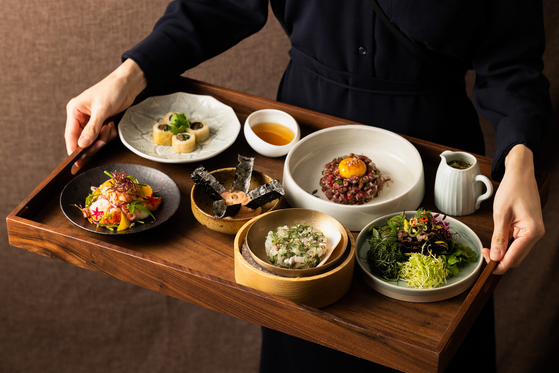 Dishes are served at the new modern Korean dining venue Jogakbo Kitchen at Andaz Seoul Gangnam in southern Seoul. [ANDAZ SEOUL GANGNAM]