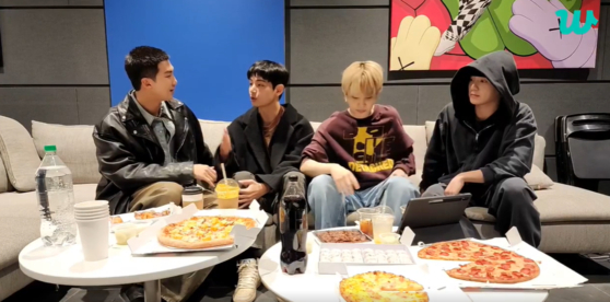 Four members of BTS participate in a Weverse livestream before starting their military service. [SCREEN CAPTURE]
