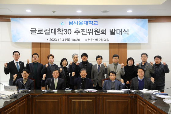 Members of Namseoul University's task force for the Glocal University 30 project pose for a photo during the task force's launch ceremony at the university's campus on Monday. [NAMSEOUL UNIVERSITY]