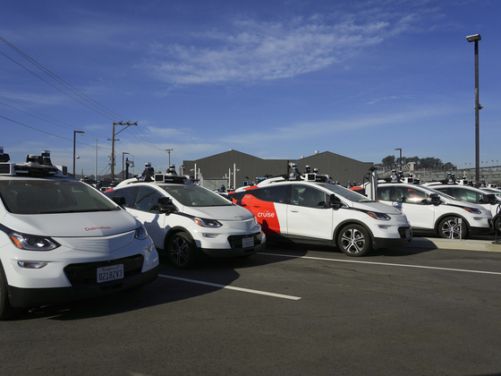Cruise vehicles on a lot in San Francisco, Nov. 1, 2023. Cruise, the embattled self-driving car subsidiary of General Motors, said on Thursday, Dec. 14, 2023 that it would eliminate about 900 jobs, roughly a quarter of its work force, as the company looked to rein in costs after an October incident led California regulators to shut down its robot taxi operations. [Jim Wilson/The New York Times]