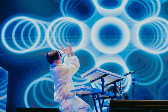 Japanese project group Yoasobi's producer Ayase performs during the group's first concerts in Korea, held last Saturday and Sunday at the Hwajung Tiger Dome in central Seoul. [LIVET, KATO SHUMPEI]