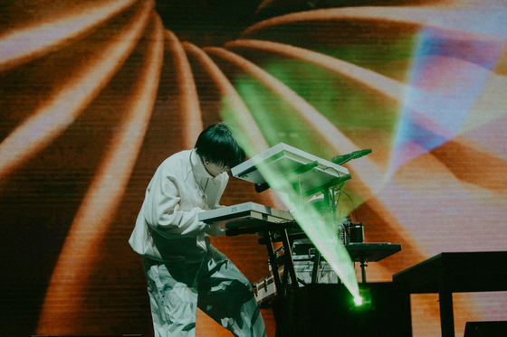 Japanese project group Yoasobi's composer Ayase performs during the group's first concerts in Korea, held last Saturday and Sunday at the Hwajung Tiger Dome in central Seoul. [LIVET, KATO SHUMPEI]
