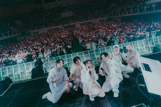 Japanese project group Yoasobi and its live band members during the group's first concerts in Korea, held last Saturday and Sunday at the Hwajung Tiger Dome in central Seoul. [LIVET, KATO SHUMPEI]