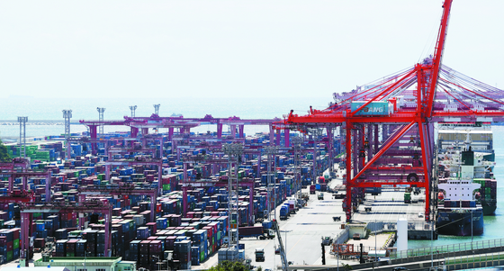 Shipping containers are stacked at a port in Busan. [NEWS1]